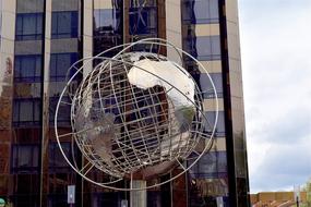 Globe Sculpture and Skyscraper