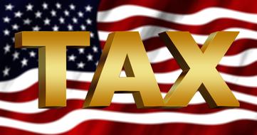 tax against the background of the American flag