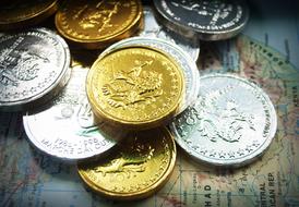 Beautiful and colorful, shiny coins with images, on the map