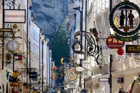 variety of business signs in getreidegasse