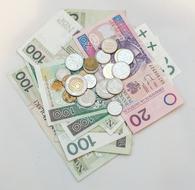 paper money and coins on white background