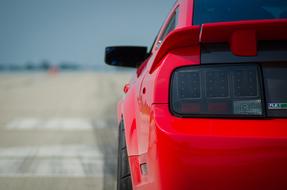 rear view of red Mustang Car, detail