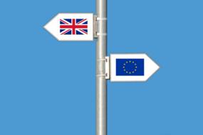 eu and united kingdom flags on opposite direction signs