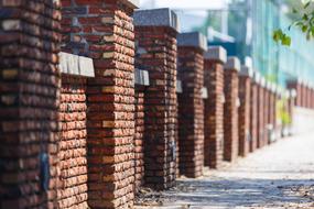 brick fence on a city street