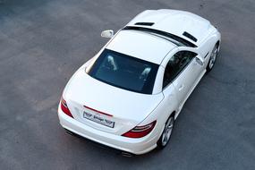 Back view of the beautiful, white Mercedes SLK car