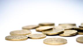 lot of coins in a white blurred background