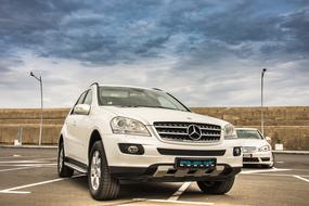 white contemporary Mercedes car on parking