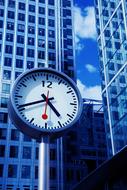 street clock on the background of a skyscraper in London
