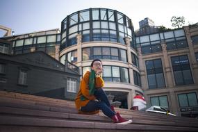 girl sitting on the stairs of the business center