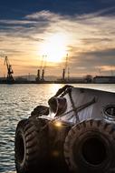Tug boat on the water, with the ripple, at colorful and beautiful sunset