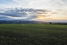 evening sky with clouds over the meadow