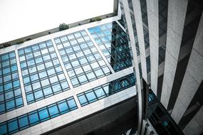 Shiny building with blue windows, with light reflection