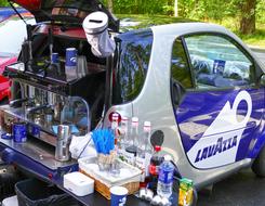 Blue, white and gray LavAzza coffee mobile car with the tools