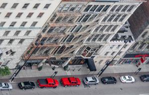 Colorful cars, on the road, near the buildings in the city