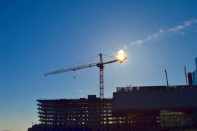 construction crane on the background of sunset on the pier in Boston