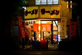 Colorful and beautiful Chinese restaurant, with the lights, in the China Town, among the darkness