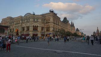 people on the background of a historic building