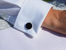 Cufflink on white sleeve