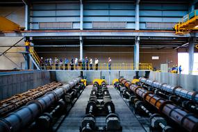 people in the workshop of an industrial plant