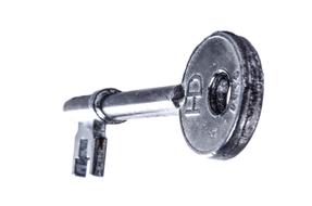 old key on white background