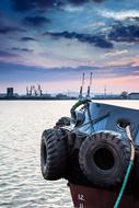 car tires in tow in the harbor