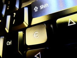 Close-up of the shiny keyboard, with the signs, in light