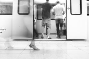 people in the subway in a blurry background