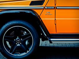 orange Mercedes Benz with tuning