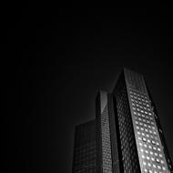 Building of "Deutsche Bank" in Frankfurt, Germany, among the darkness