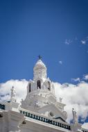 blue bright sky over white building