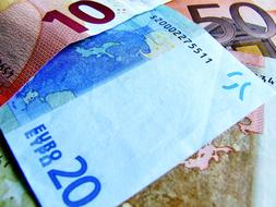 Colorful, different Euro banknotes, with the numbers