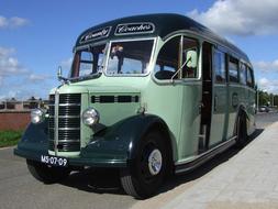 Mint and black bus, on the road in Netherlands