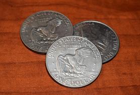 three silver coins, close-up