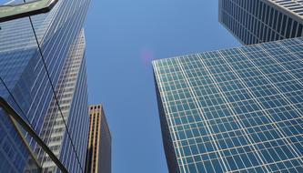 Colorful, shiny buildings, with the windows, under the blue sky