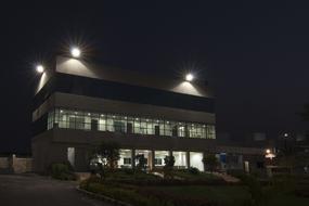 Office building with windows and lights at night