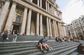 People on Stairs near Building