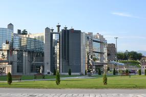 Building of Endava, with the green field with trees, in Skopje, North Macedonia