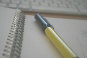 pen on notepad close-up