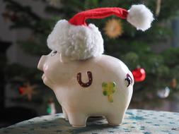 ceramic piggy bank in santa hat