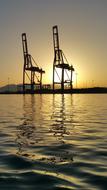 distant view of harbor cranes on the Malaga coast