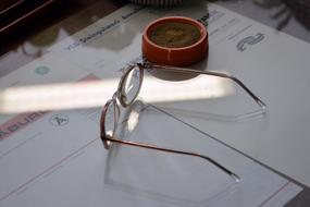 Shiny glasses on the desk, in the museum in East Germany