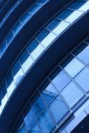 Shiny building, with the blue windows, with the reflections, in the city