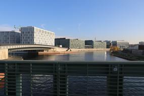 Cityscape of Berlin, Germany, with water in sunlight, among the buildings