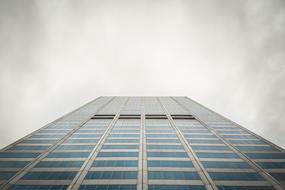 office building under gray clouds