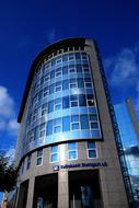 exterior of an office building in the city on a sunny day