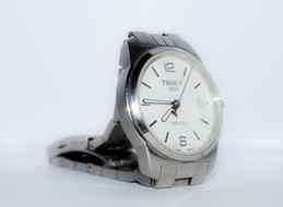 mens silver watch on white background