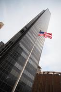 American Flag and skyscraper Building