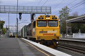 yellow train at the railway station