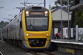 Train on the railway, at the station, among the trees