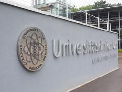 Emblem of the "University Ulm" on the wall in Ulm, Germany